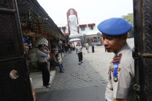 Police guarding the Ekayana Vihara following Sunday's bombing (photo from the Jakarta Post)